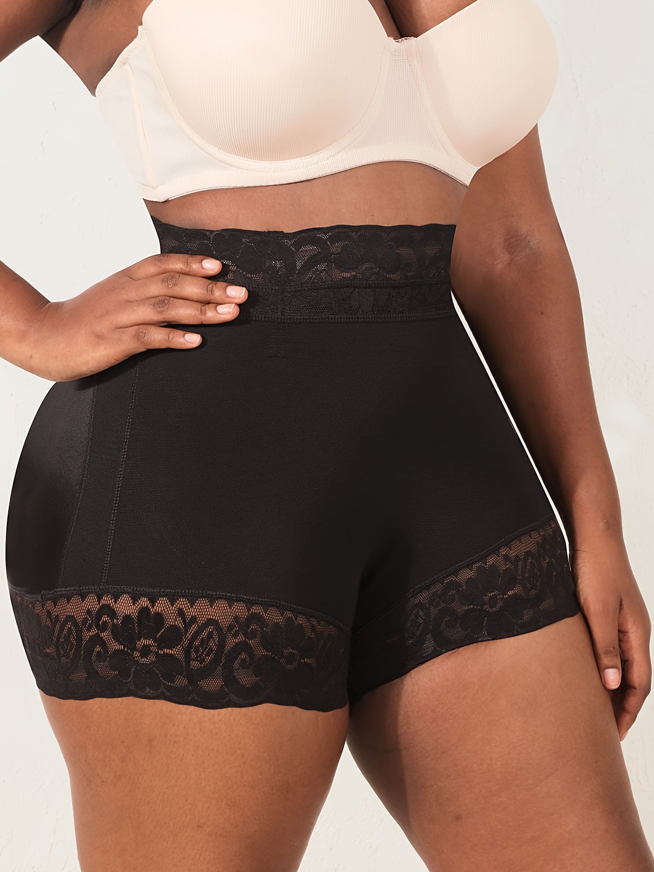 High waist shapewear shorts for plus-size women with lace trim, providing tummy control, butt lifting, and a comfortable fit.