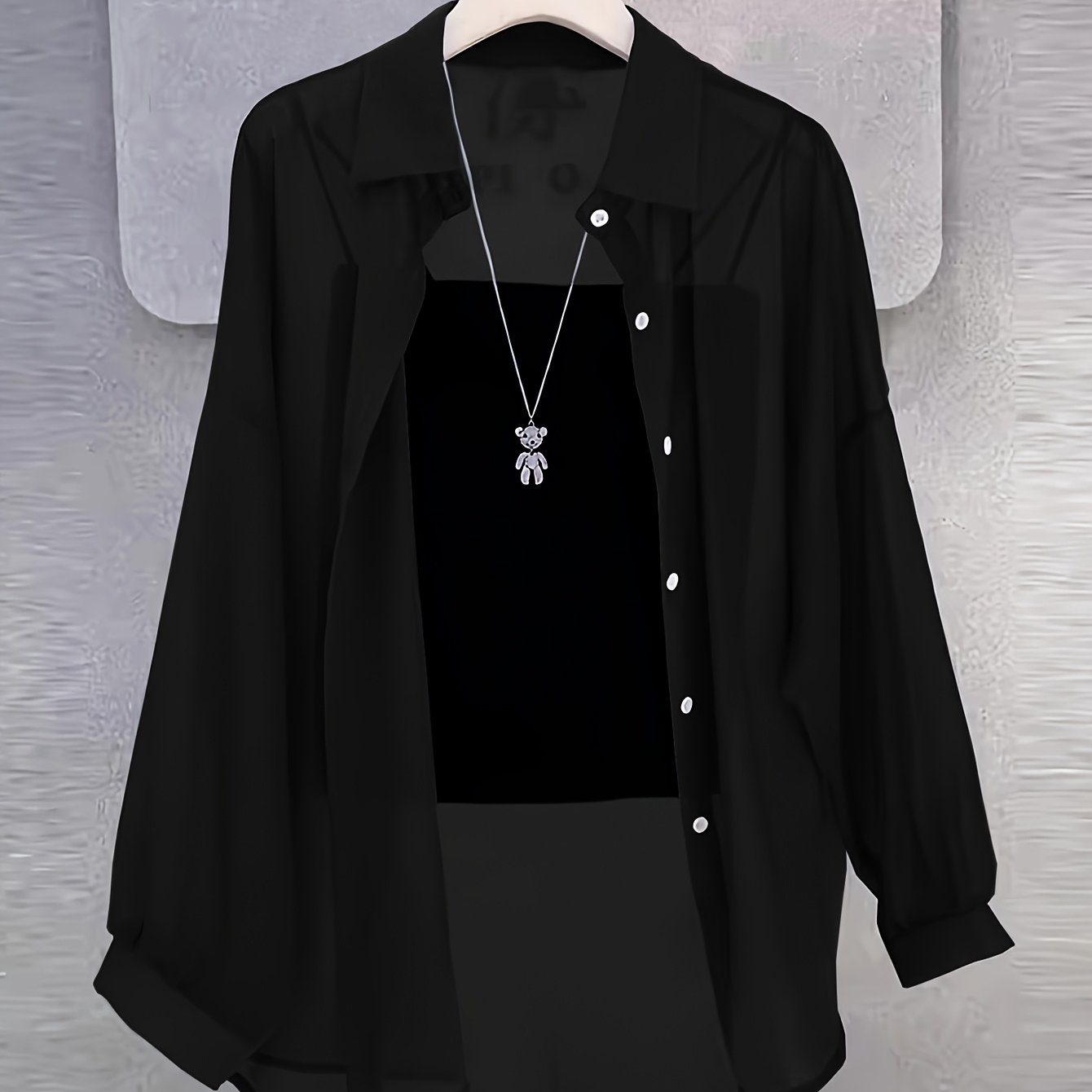 Casual women's shirt with buttons, sheer long sleeves for spring and fall.