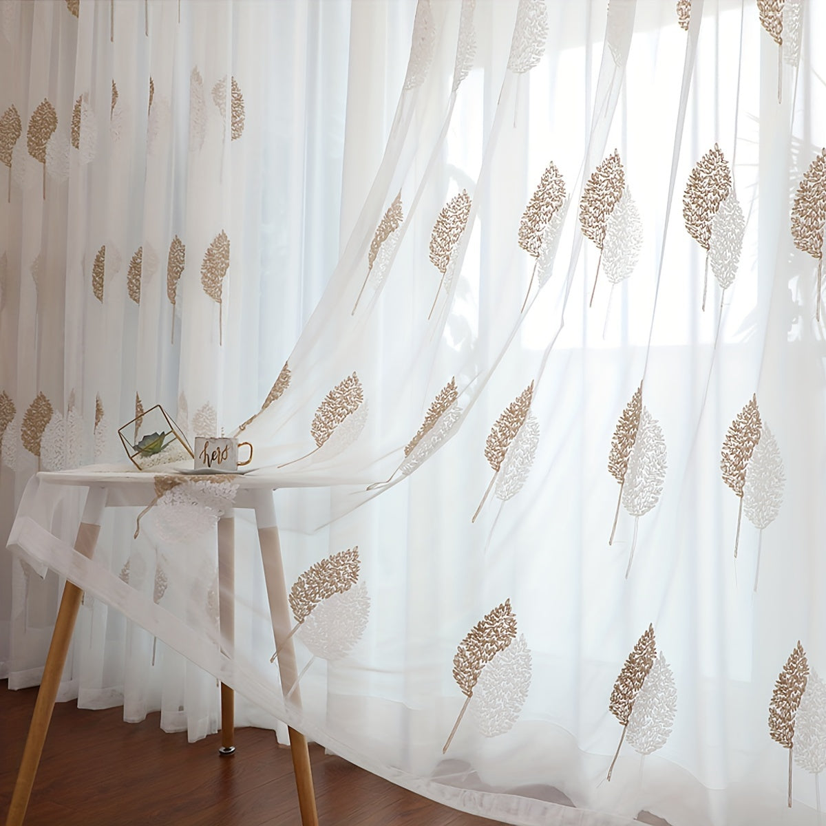 Add a touch of pastoral elegance to your home with this beautiful sheer curtain featuring delicate leaf embroidery. This translucent tulle curtain is easy to hang with a rod pocket design, perfect for adding a subtle touch of style to your living room or