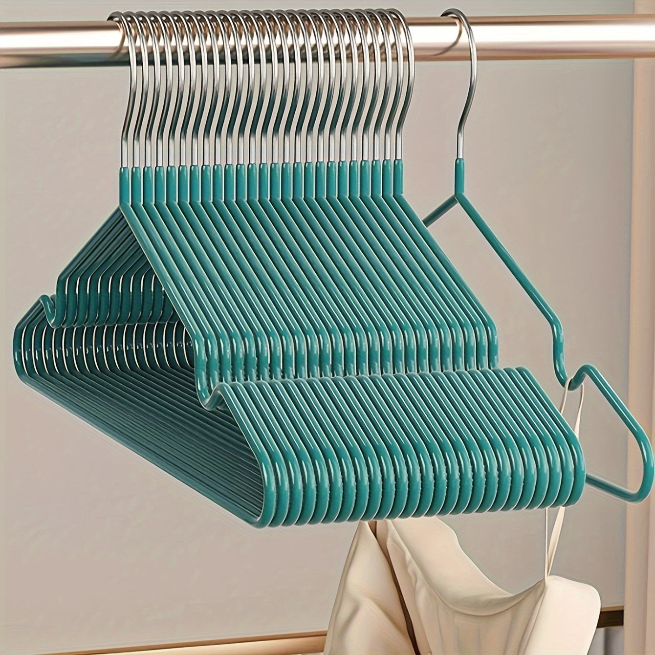 Essential for any home wardrobe, these durable non-slip metal hangers come in a convenient 10-pack. Featuring shoulder grooves to keep clothing in place, these space-saving hangers are perfect for hanging tops and dresses.