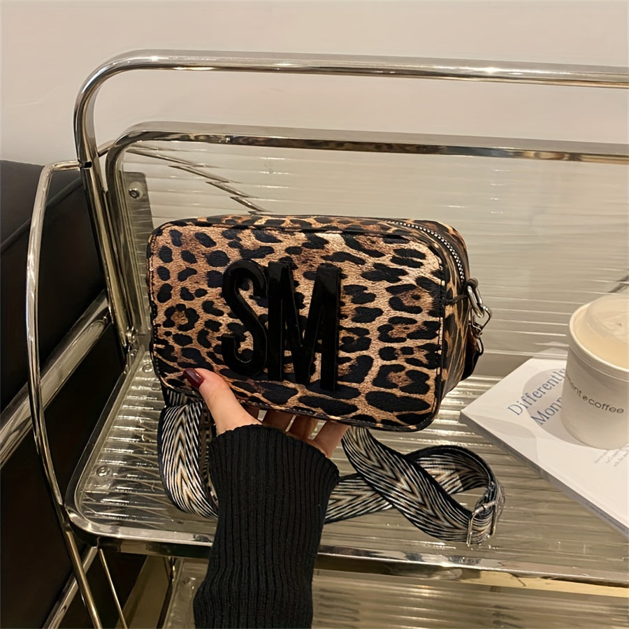 Leopard print PU crossbody bag with detachable strap in deep brown, perfect for casual or commuting outfits. Bold letter design on small shoulder bag.