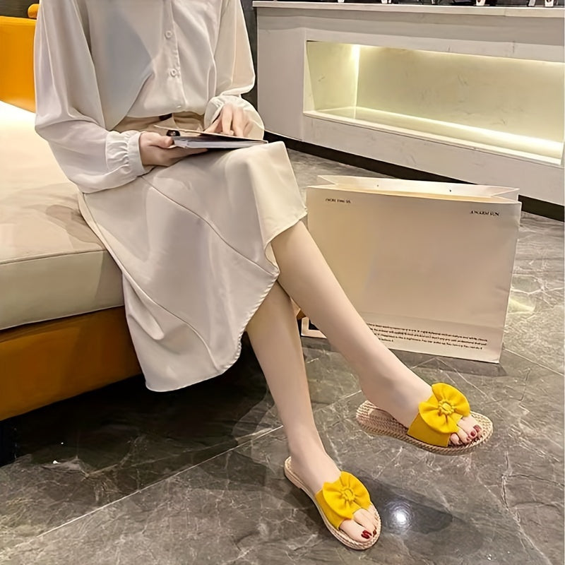 Women's PVC slip-on sandals with bow and bead accents, flat heel, open toe, ideal for beach wear.  Bow embellished, made from synthetic material.