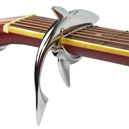 Stylish zinc alloy capo for acoustic and electric guitars, changes pitch.