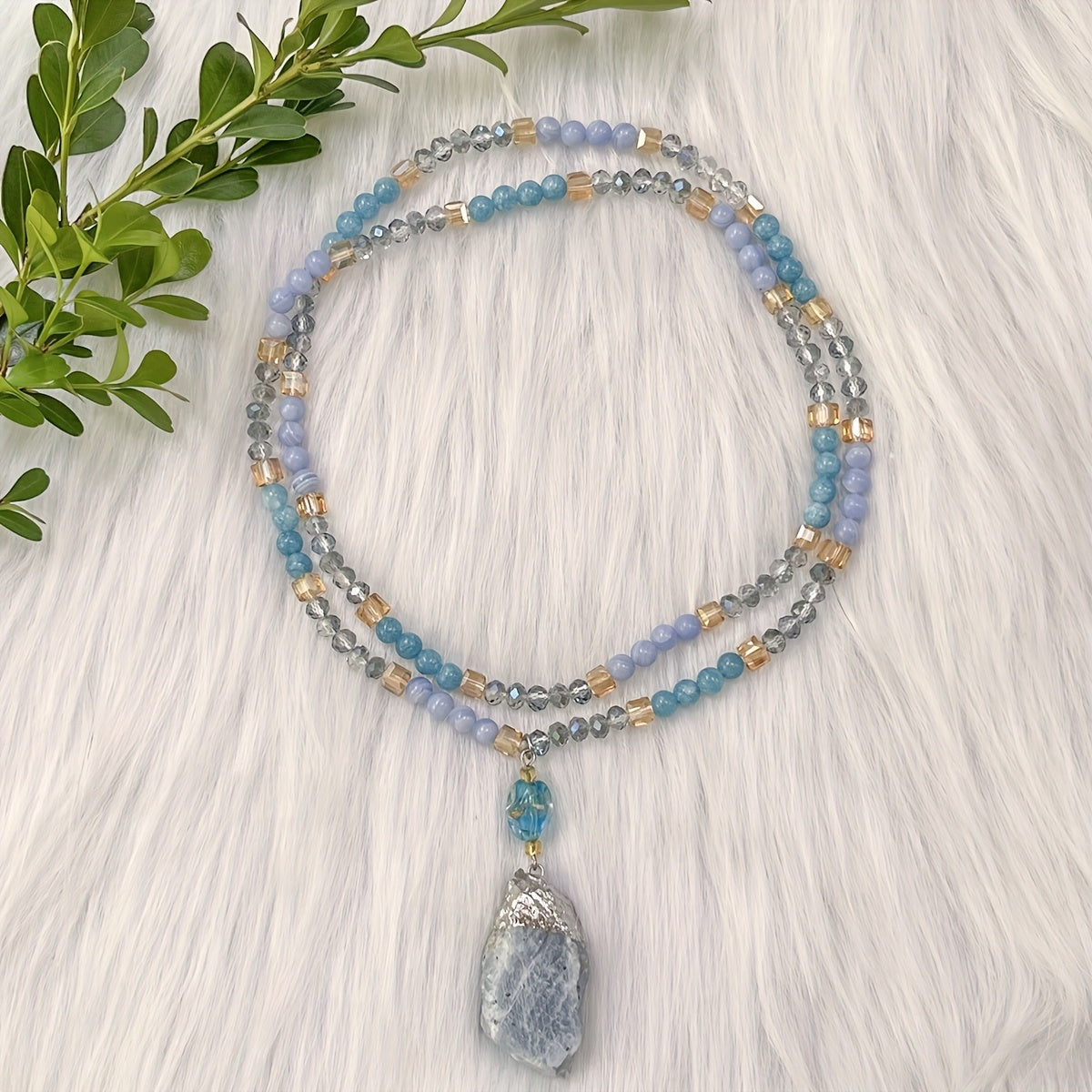 Unique vintage-inspired mala necklace featuring a raw kyanite pendant, beautiful blue lace agate and amazonite beads. Hand-beaded with love, this crystal japamala promotes chakra mindfulness and inner peace. This elegant boho accessory is perfect for any