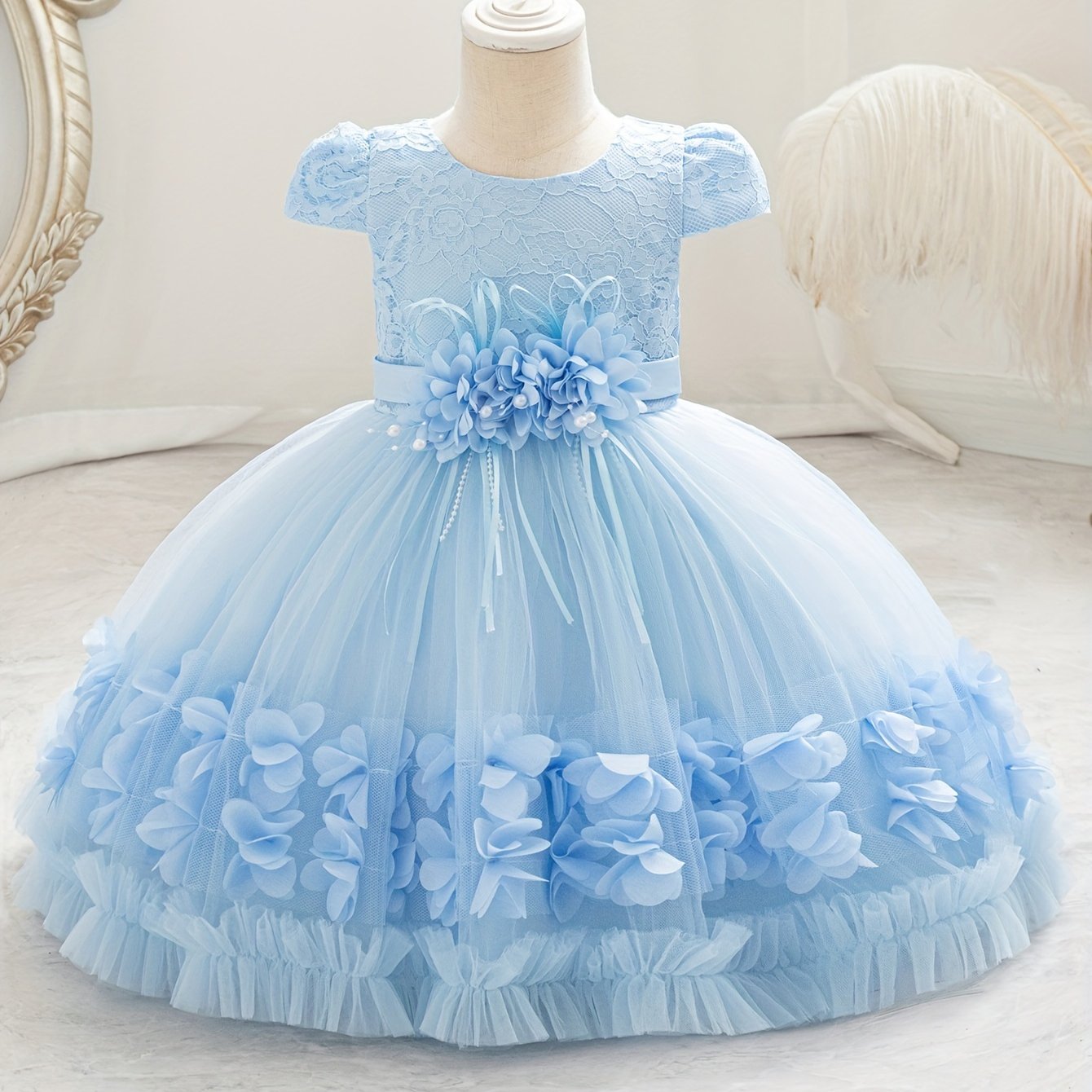 Baby's floral tulle princess dress with lace sleeves for formal occasions.