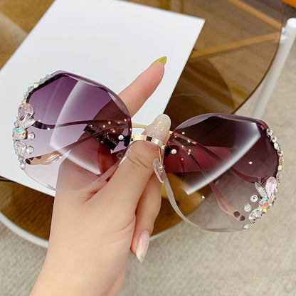 Purchase one and receive one free rhinestone glasses with a frameless gradient lens and a unique bent leg design.