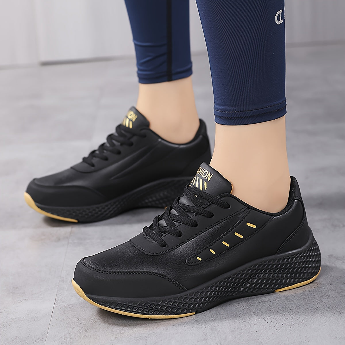 Black platform sneakers for women with lace-up design and comfortable fit, suitable for outdoor activities.