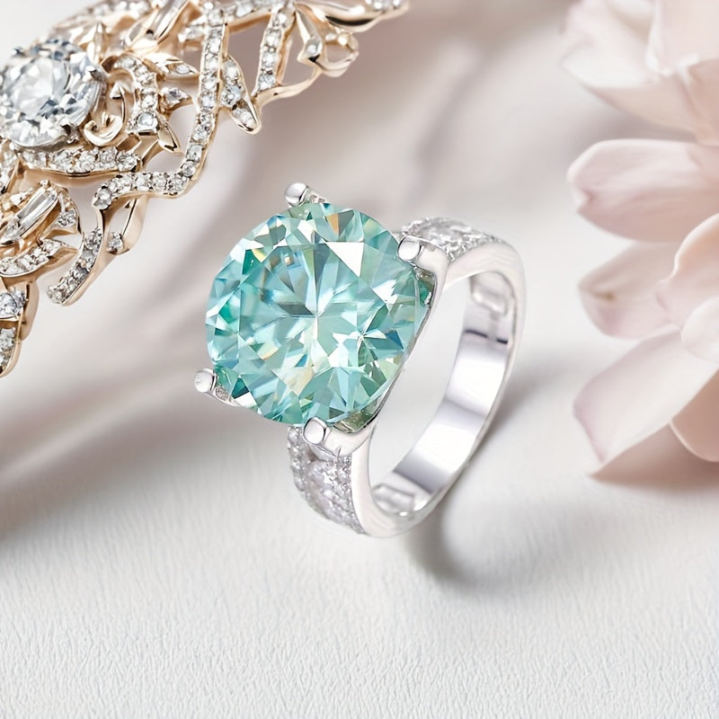 This stunning 10CT Teal Moissanite Engagement Ring features a sparkling 925 silver band, making it the ideal choice for weddings, parties, and as a December birthstone gift.