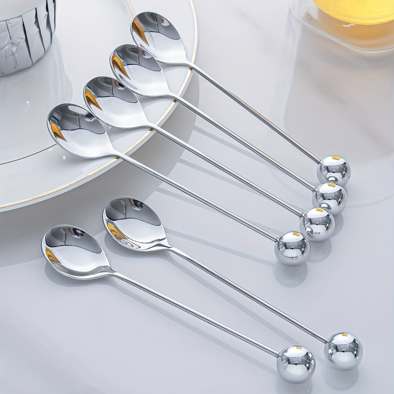 2 golden and silver round ball decorated dessert spoons, perfect for coffee, cake, and snacks.