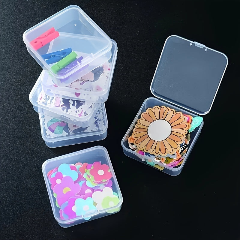 Small transparent storage boxes with hinged lids, ideal for storing stickers and other accessories. Can also be used as a portable organizer for various items. Available in packs of 5 or 10.