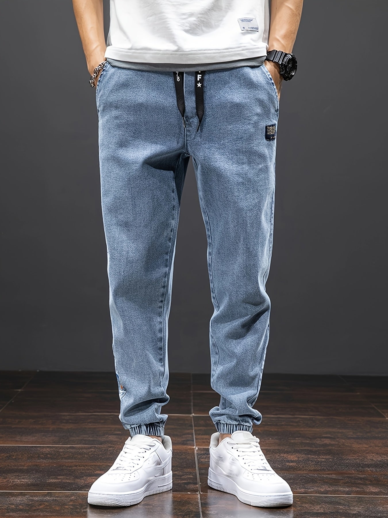 Men's mid-rise cropped jeans with elastic waistband made of 70.7% blend, solid color washed denim, regular fit for all-season wear.