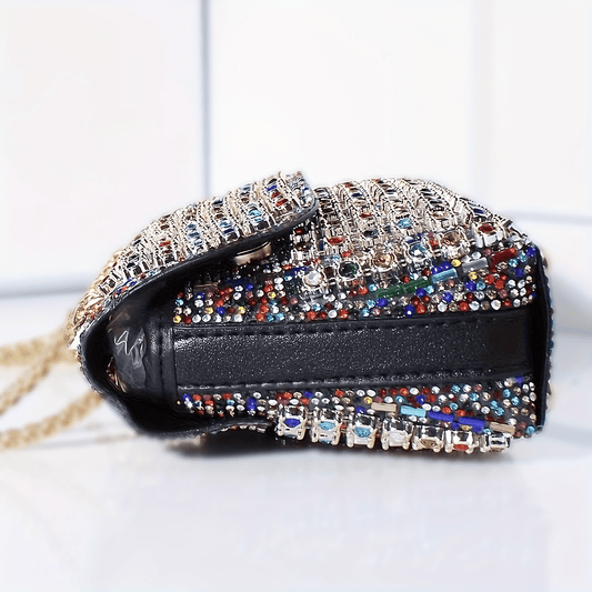 Stylish women's evening clutch with rhinestones and beads, adjustable strap, and magnetic closure, perfect for formal events.