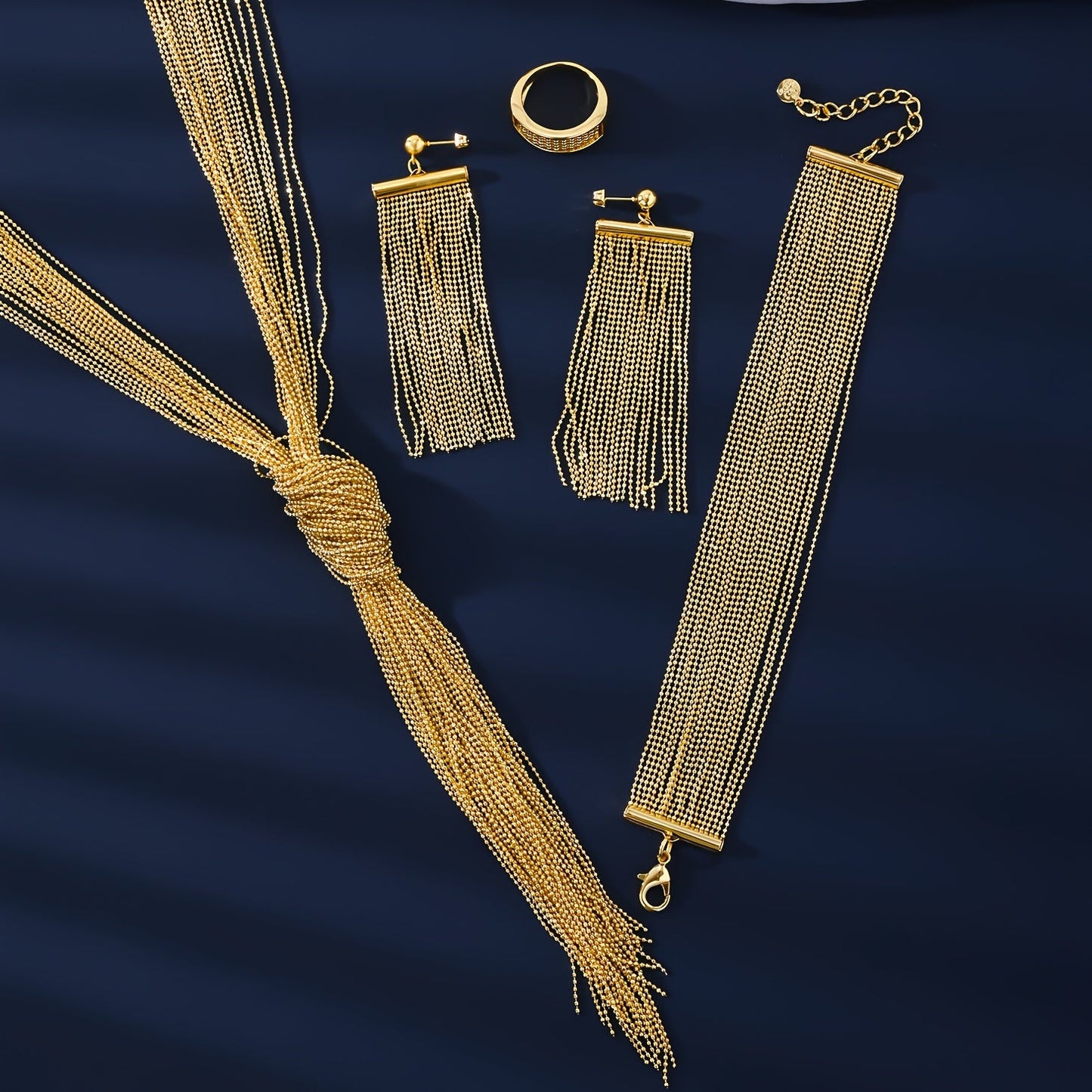 Experience the Exquisite MEIZ Luxury Hip-Hop Style Jewelry Set, featuring 18K Golden Plated Copper with Hollow Tassel Earrings, Tassel Necklace, Ring, and Bracelet. Perfect for Daily Wear or as Wedding Accessories, this Set is Ideal for Gift-Giving and