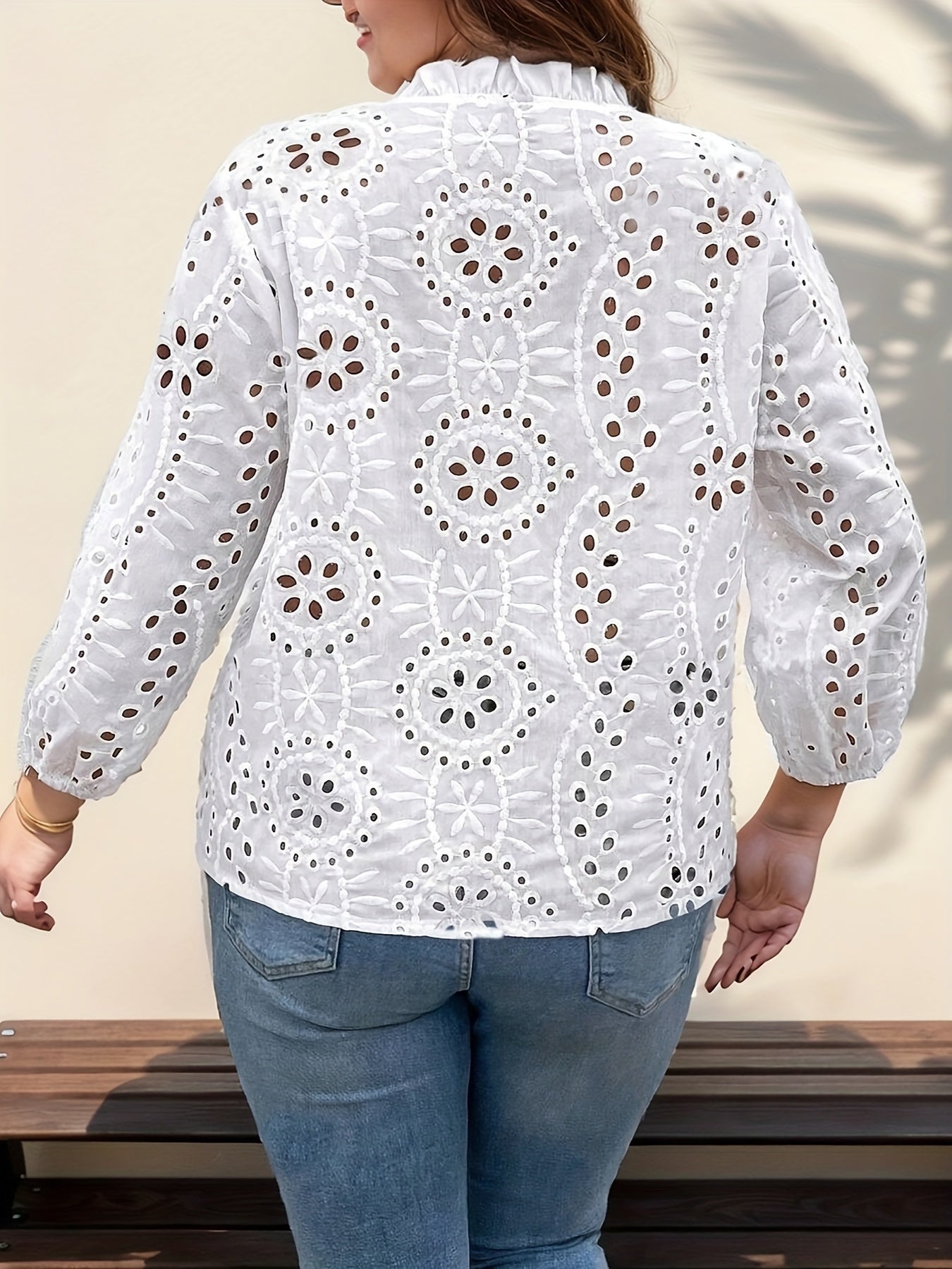 Stylish V-neck blouse with eyelet detail, casual and breathable in polyester/spandex blend, ideal for spring or fall.