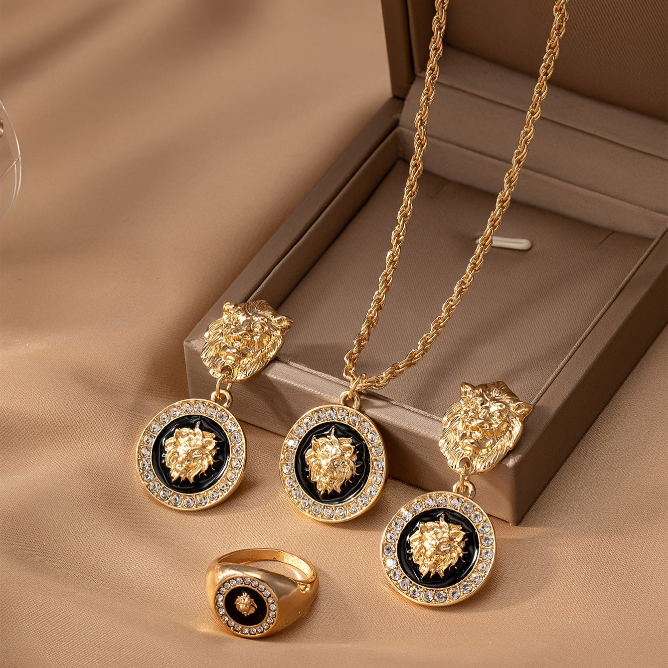 A set of European and American retro elegant temperament lion head jewelry, including an enamel charm necklace, a pair of charm earrings, and a ring adorned with lion heads.