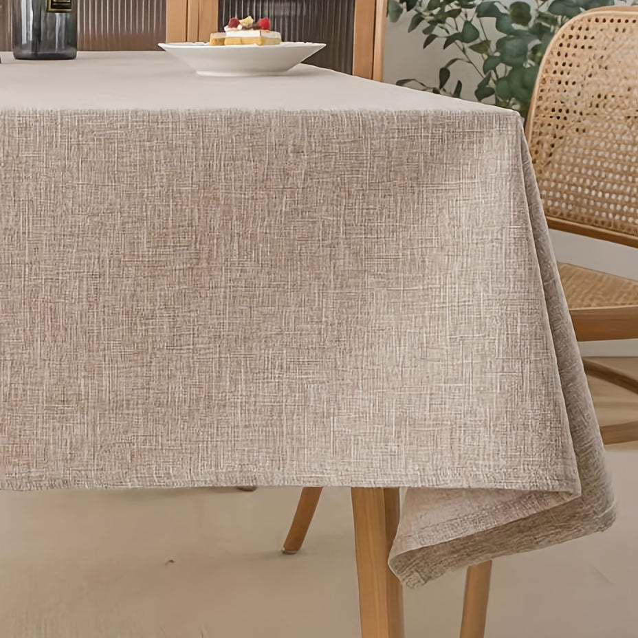 Beige rectangular polyester tablecloth for picnics or holiday gatherings with simple style, ideal for home dining decor.