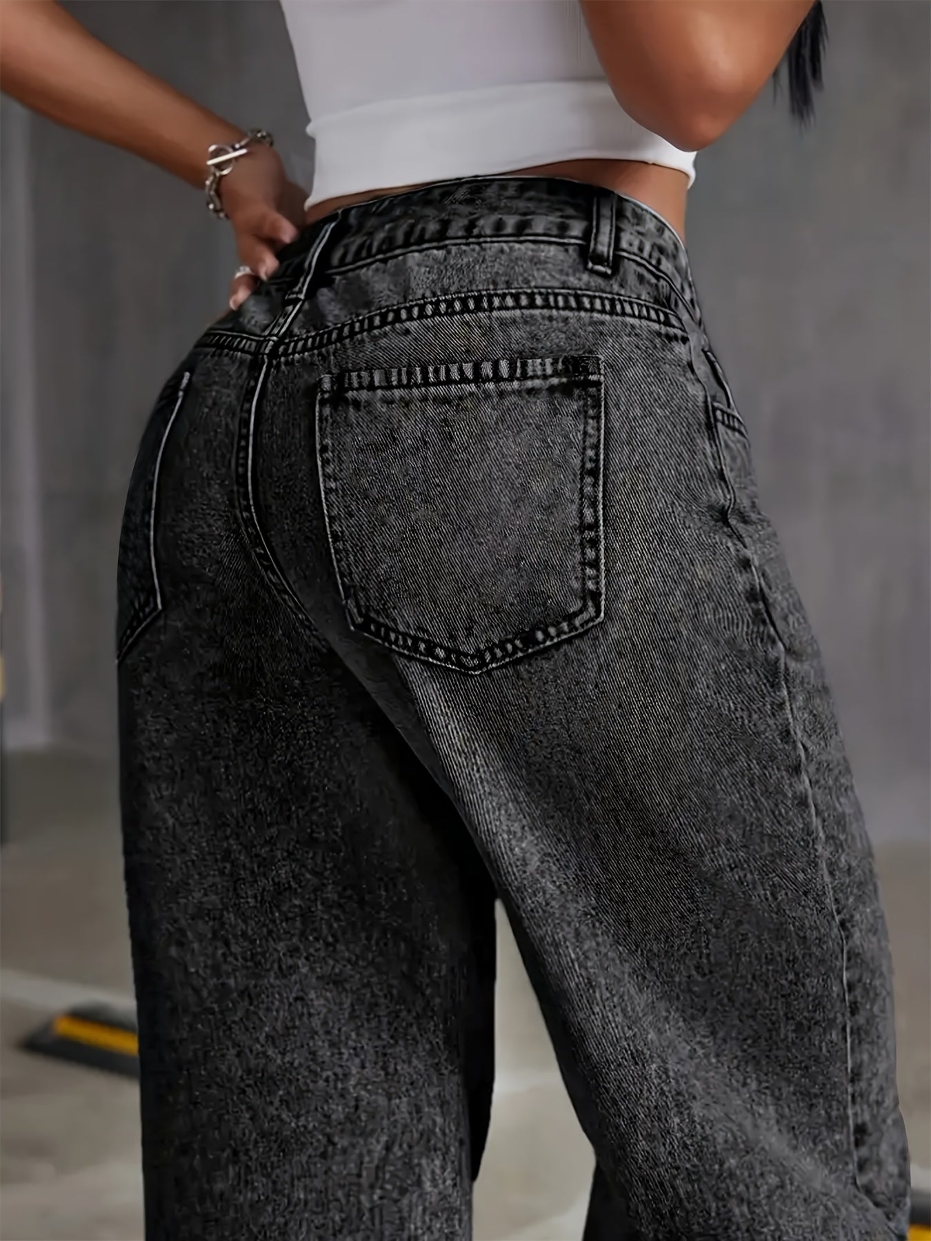 Women's high-waisted straight leg stretch denim jeans in snowflake wash, black distressed denim with raw hem detail, all-season casual wear for classic comfort.