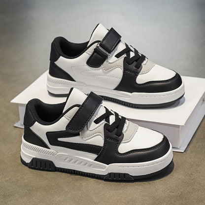 Boys' athletic sneakers in black, white, and grey with non-slip, breathable lining, hook-and-loop strap, and durable sole. Perfect for all seasons.