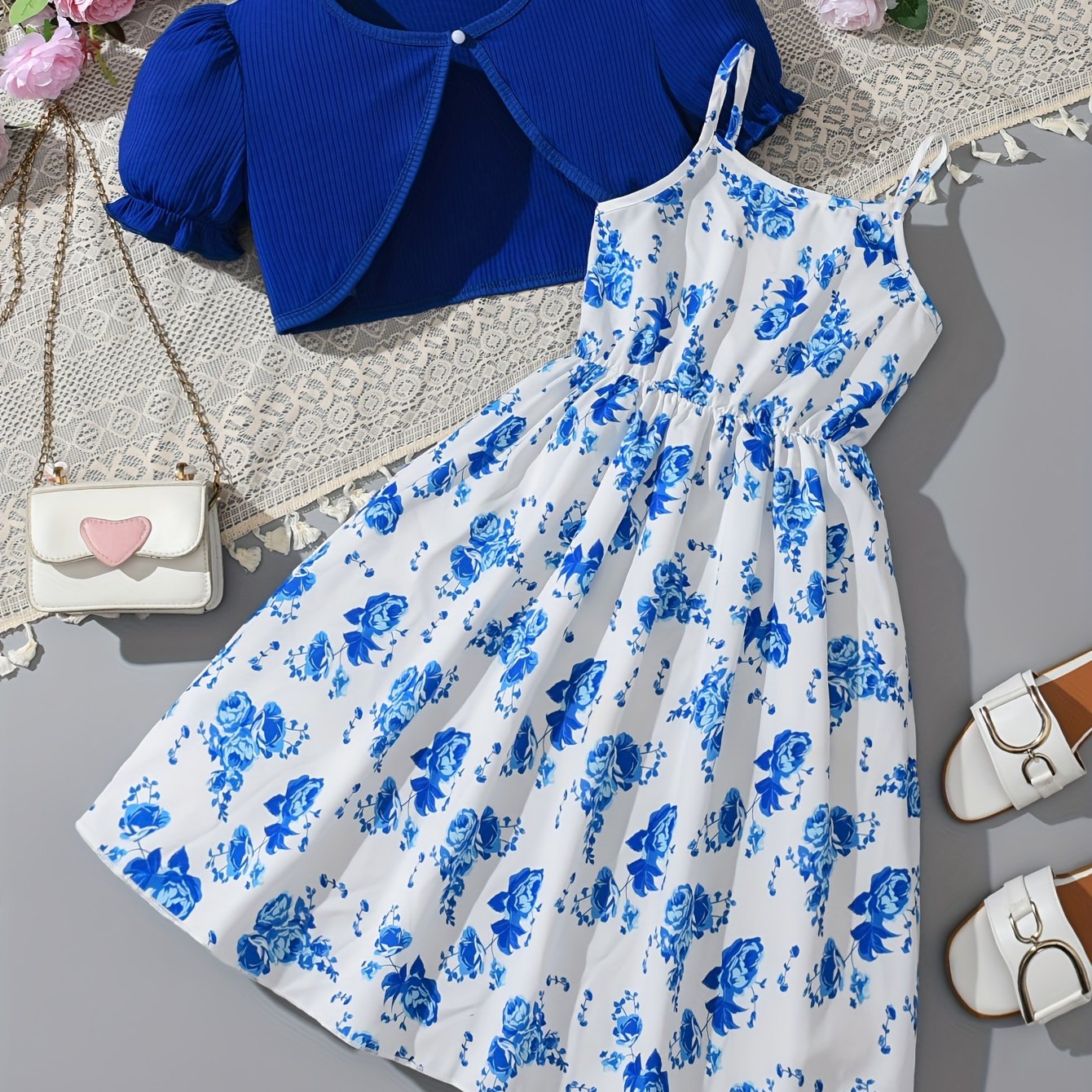 2-piece girls' spring/fall dress set with floral umbrella skirt and crew neck knit top. Made of 100% polyester, features long sleeve ruffle hem and button detail. Great for daily wear and