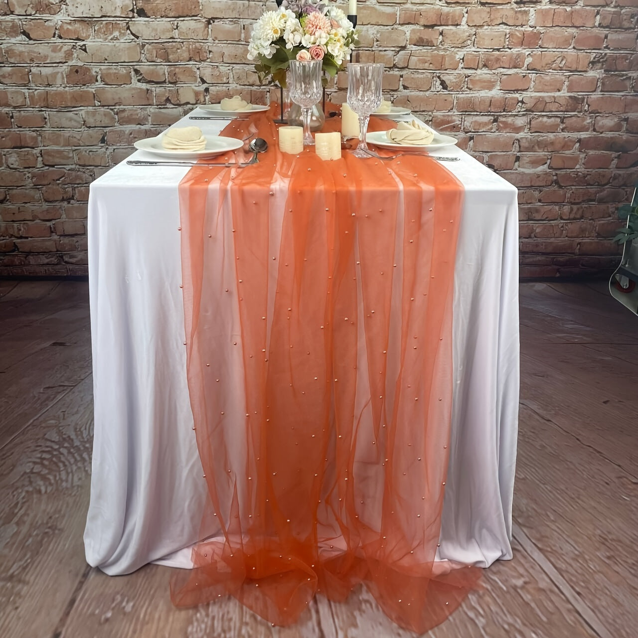 Elegant pearl bead tulle table runner, perfect for weddings and parties. Can also be used as a chair sash or backdrop drape. Made from 100% polyester fabric with delicate bead detailing.