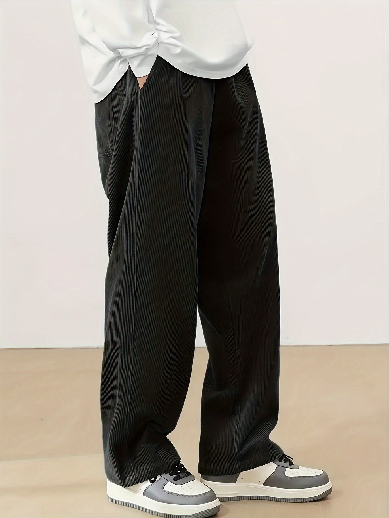 Men's plus size corduroy pants with pocket detail for fall/winter, featuring a letters print.