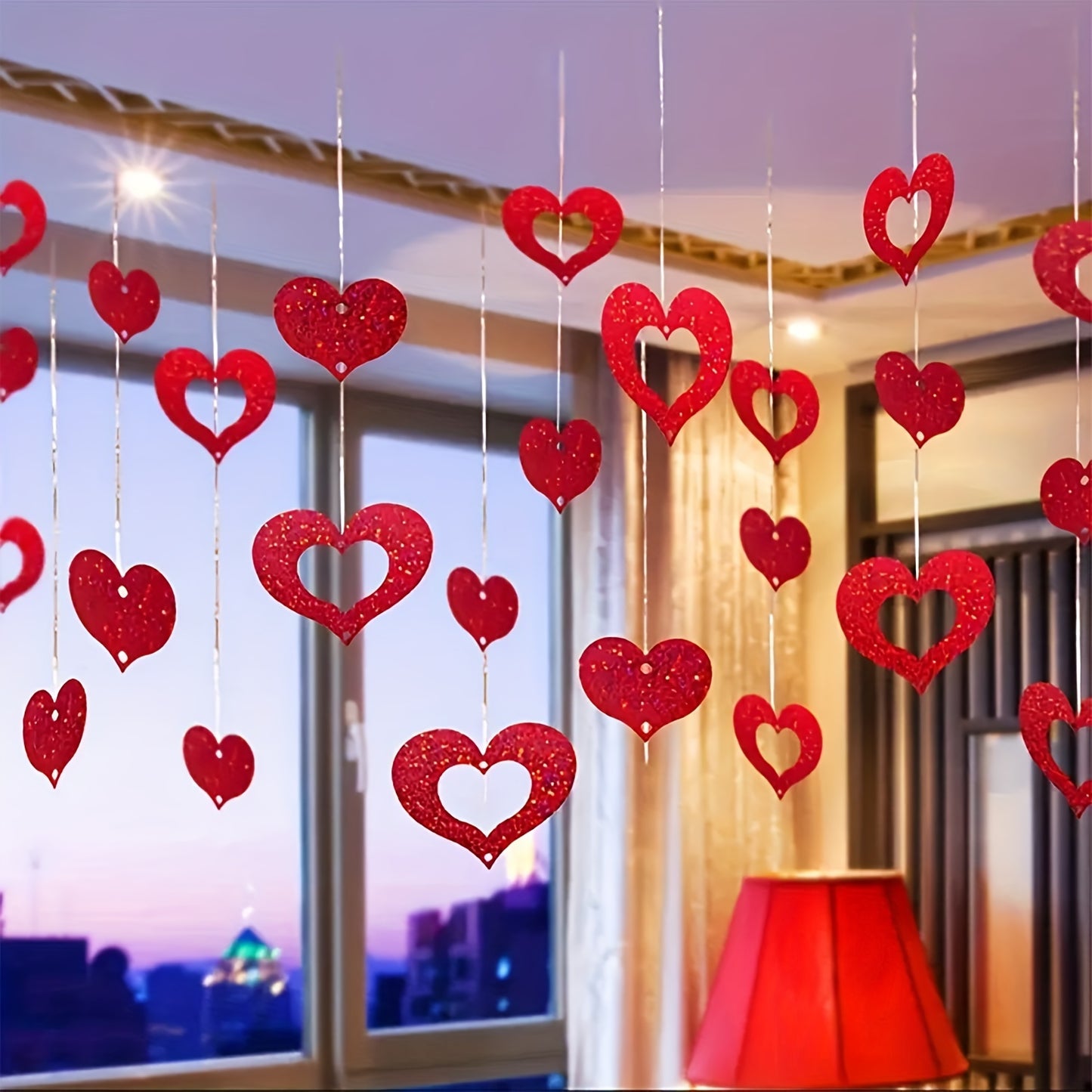 200 Valentine's Day hanging heart decorations. Ideal for weddings, birthdays, parties, and romantic room decor. Made of plastic red hearts and silk strings. Non-electric and featherless.