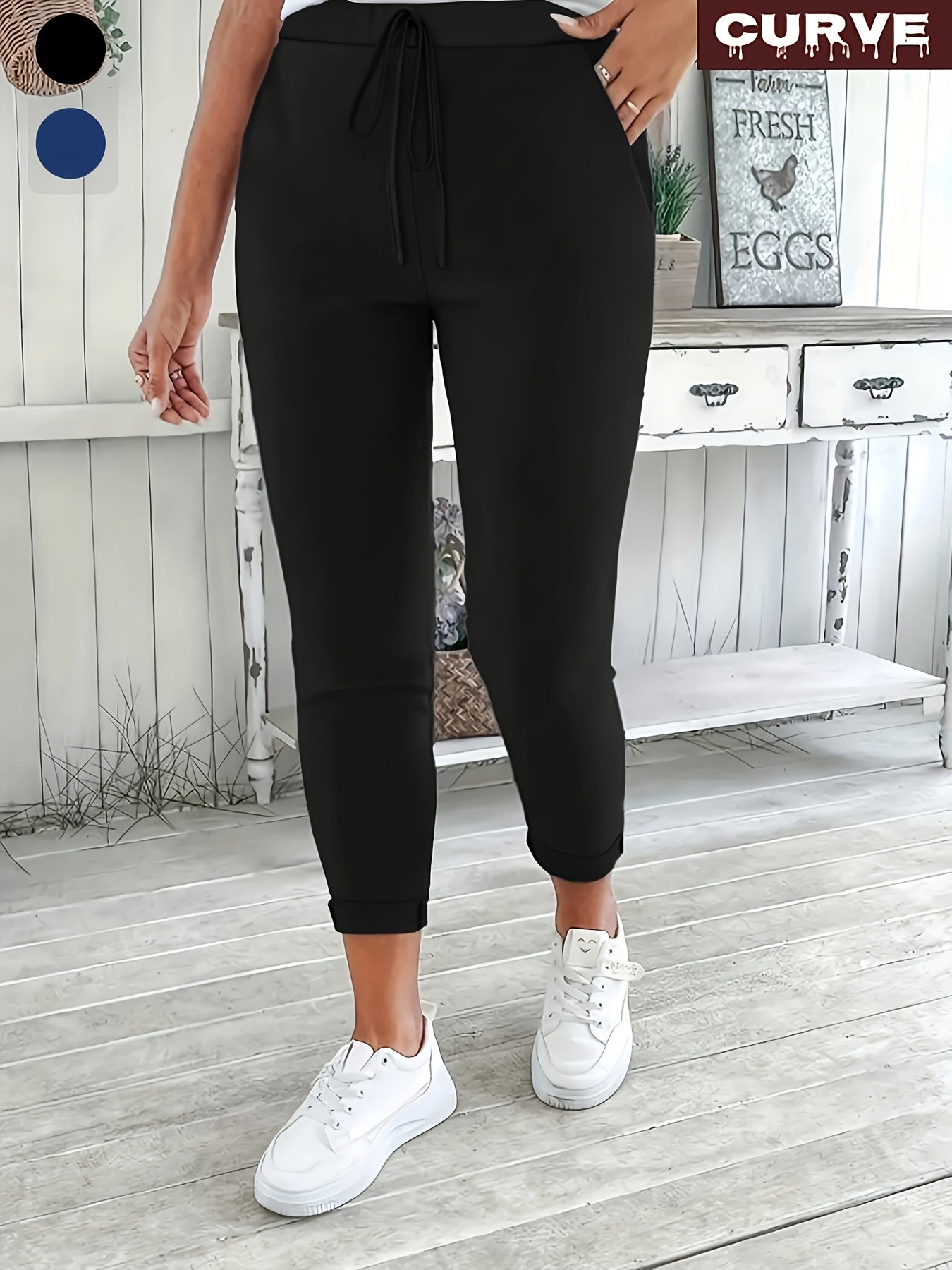 Women's plus size solid color straight leg pants with pockets, drawstring, and relaxed fit for casual wear.