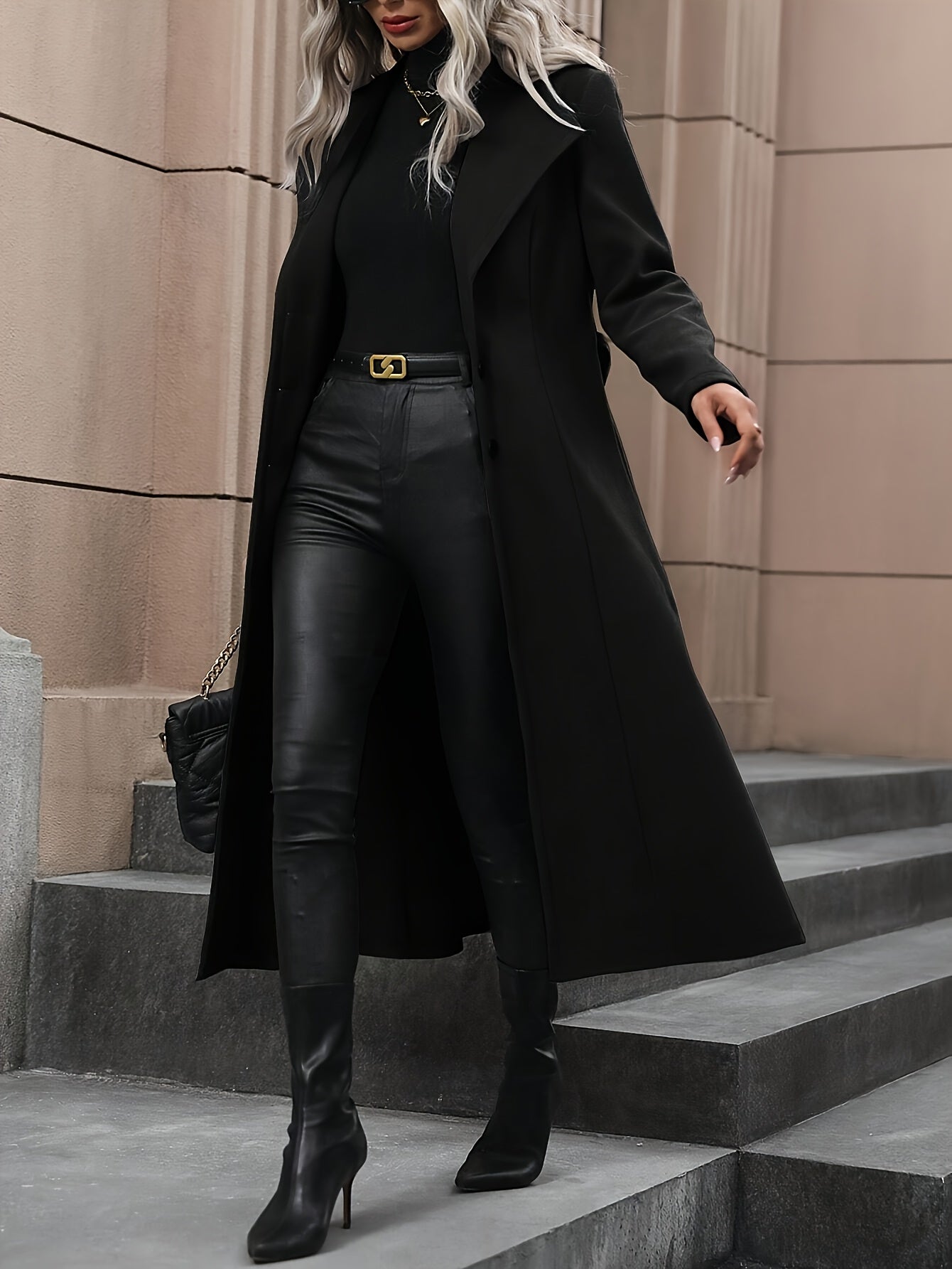 Stylish black trench coat with belt for women's fall/winter outerwear collection.