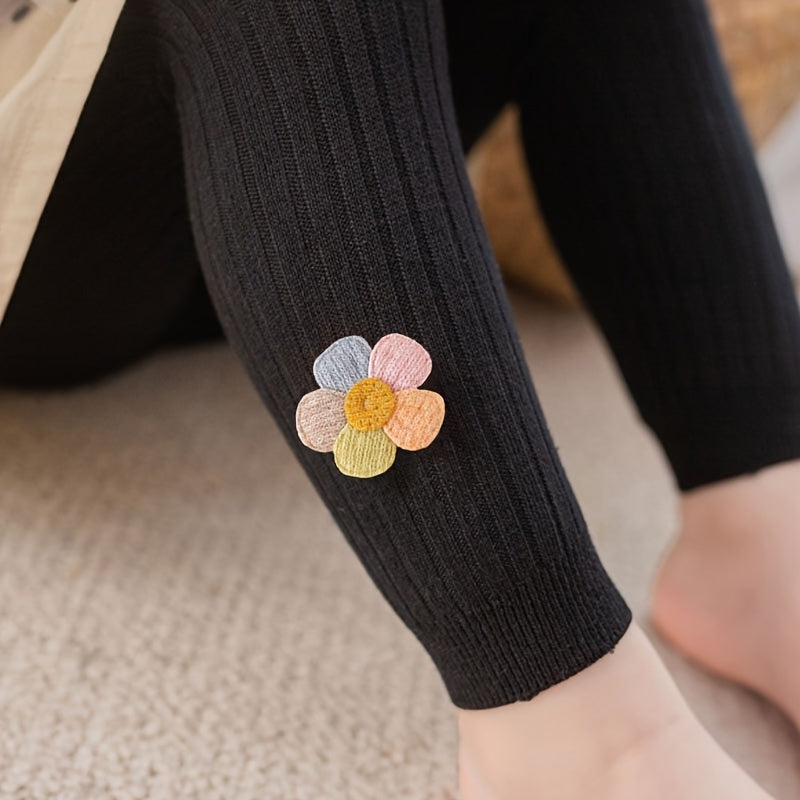 Girls slim legging pants with rib knit flower doll design, made of cotton blend stretch fabric for a tight fit.