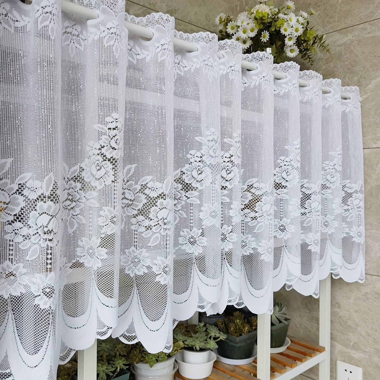 Bring elegance to your windows with our 1-piece White Lace Sheer Curtain featuring delicate floral patterns. This curtain has a rod pocket, scalloped bottom, and is made of lightweight polyester voile, perfect for dining rooms and kitchens. It is