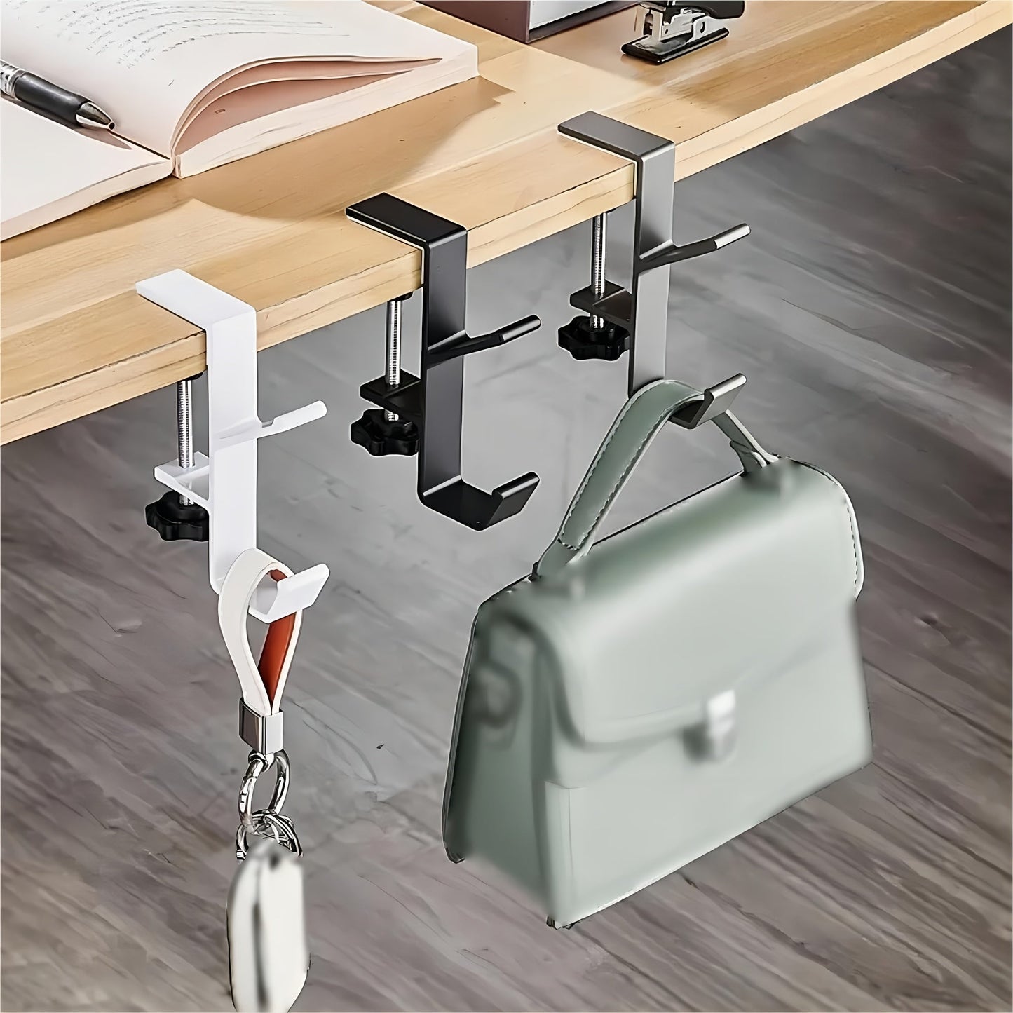 Get your hands on the convenient 1pc Versatile Under-Desk Hook! This adjustable hook has a high-load capacity and is easy to install. It's perfect for hanging bags on your home office desk or school desk table. This portable and practical hook is a