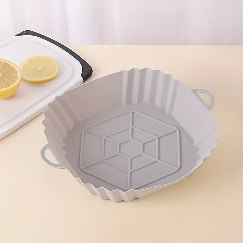 Get a square-shaped 1-piece reusable silicone air fryer baking pan that is non-stick and heat resistant up to 240°C. It comes with textured grip handles for easy handling and is perfect for making crispy chicken and more. An essential kitchen accessory