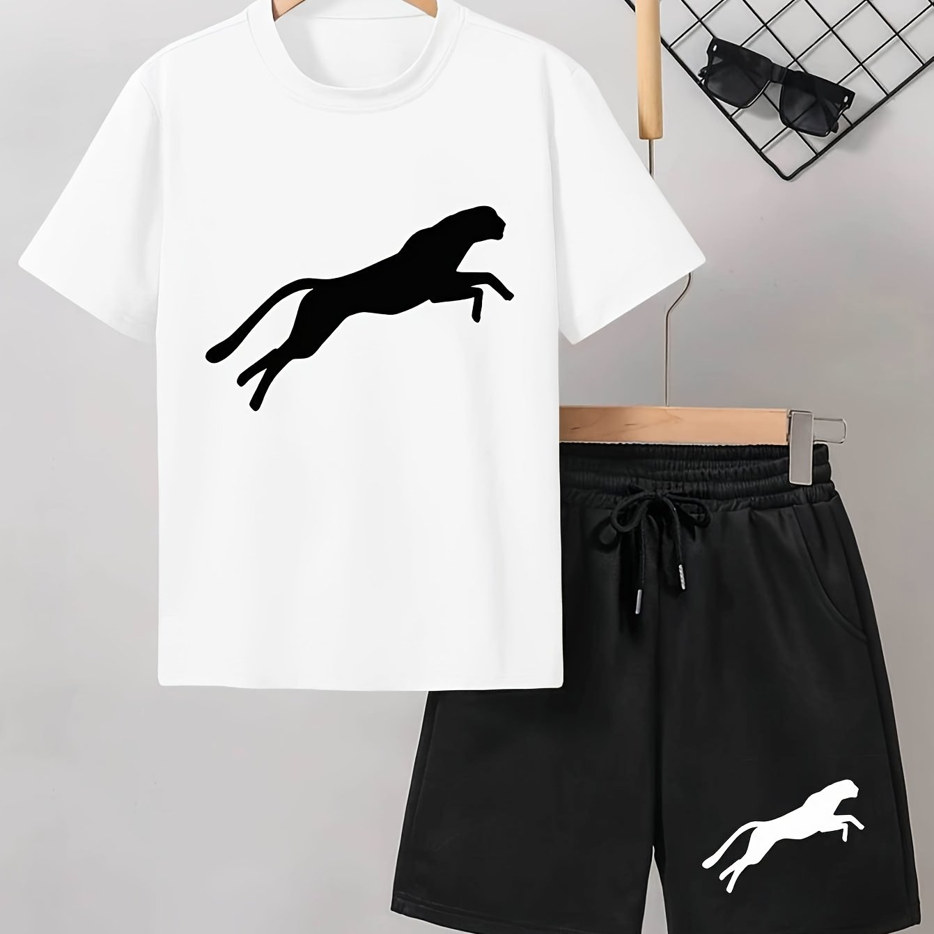 Men's casual Leopard Print Tee and Shorts Set in Light Gray with a Black Leopard silhouette on the t-shirt and White Leopard design on the black shorts. Made of a polyester blend for a