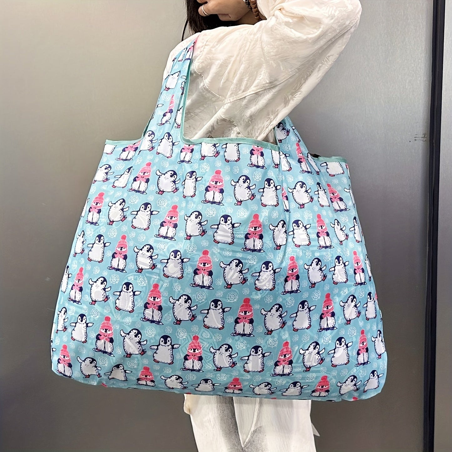 Durable and Lightweight Penguin Pattern Tote Bags - Perfect for Shopping, Groceries, and Everything in Between! These reusable and foldable totes are also recyclable, water resistant, and compact enough to fit in your pocket.