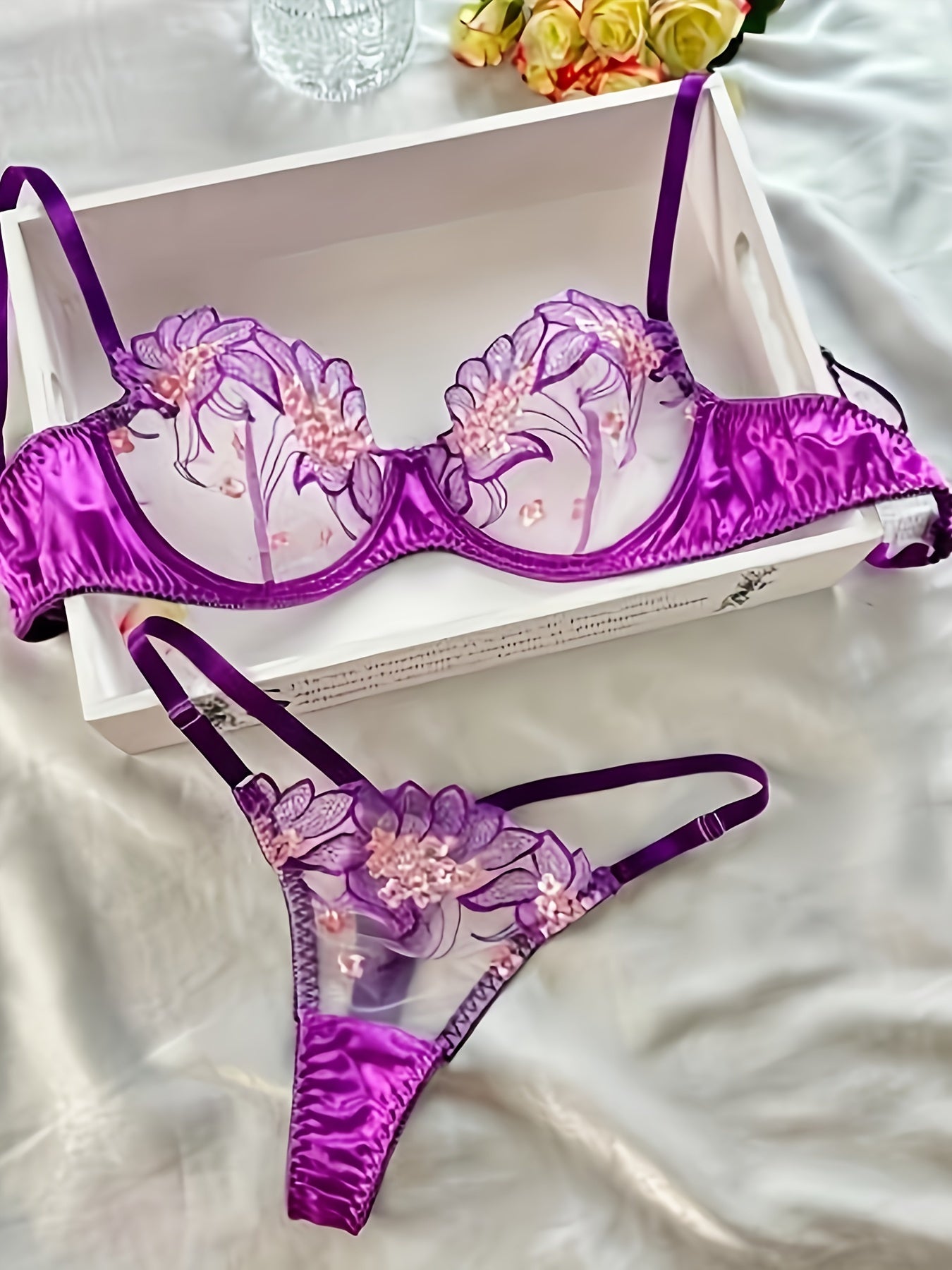 Floral embroidered sheer lingerie set with low cup non-padded bra and G-strings for women.