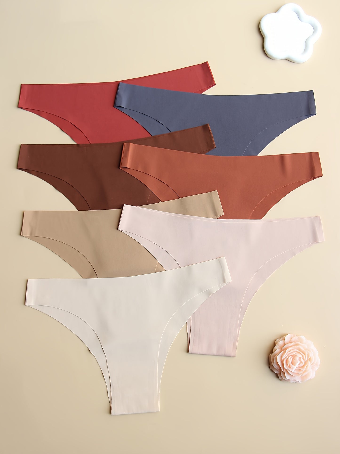 7-pack of seamless low-rise women's panties in solid colors. Stretchy, no-track, comfortable, breathable, and soft. Simple style.