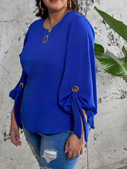 Elegant plus size royal blue satin blouse with tie sleeves, round neck, and smooth texture. Perfect for spring, summer, and fall.