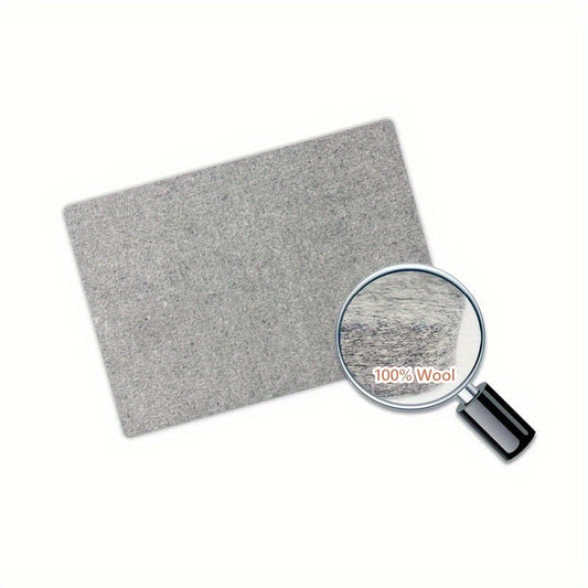 This portable wool pressing mat is perfect for quilting and sewing. It measures 25.4x0.0cm / 34.29x34.29cm and is made of felt for ironing. No power is needed, making it ideal for craft supplies.