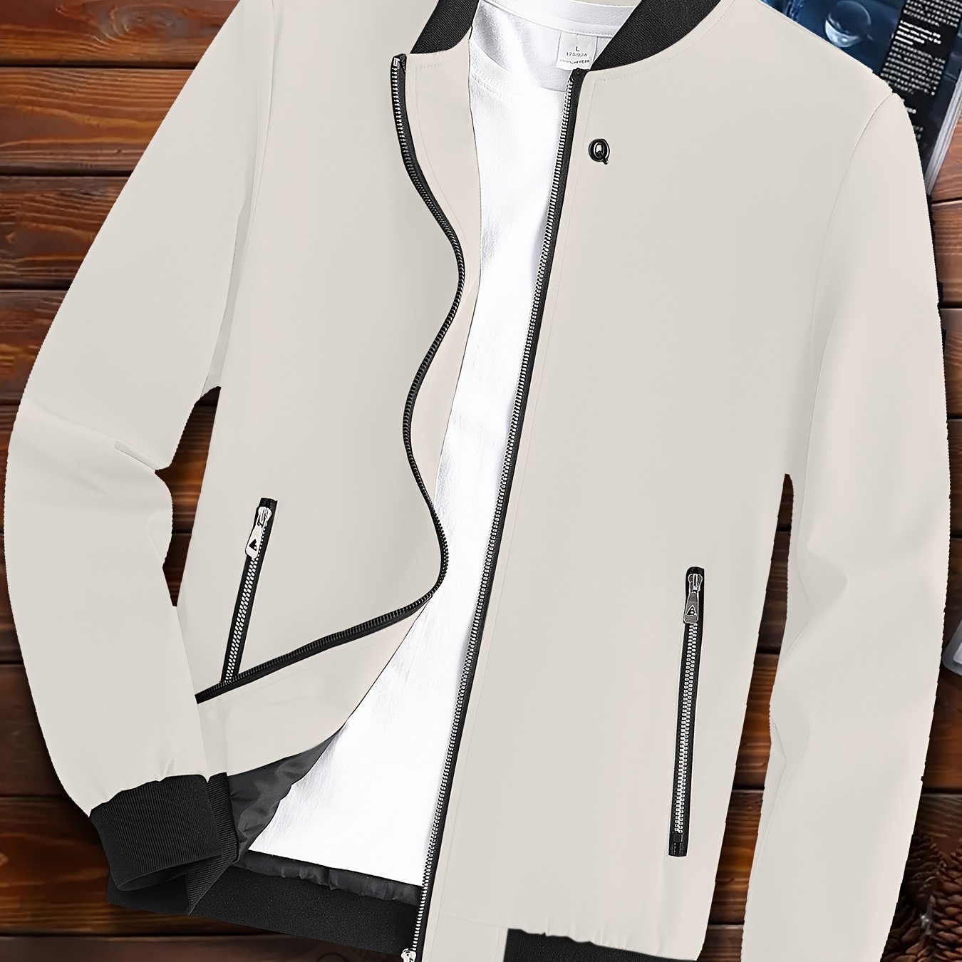 Casual men's windproof jacket with pockets for spring and fall, featuring a lightweight design and stand collar.