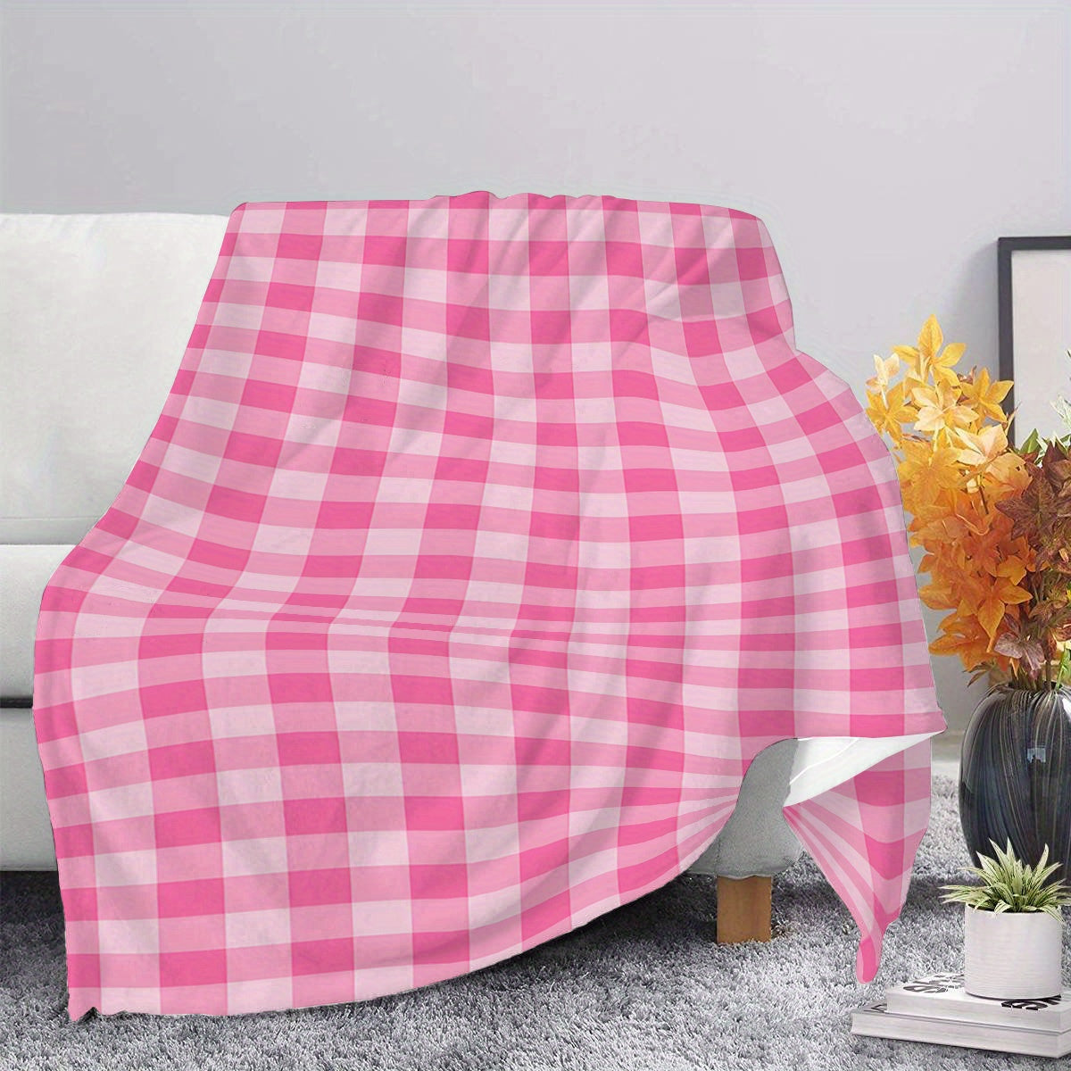 Soft and cozy polyester knit pink gingham flannel throw blanket. Ideal for adding a touch of contemporary style to your bedroom, sofa, or living room decor. Perfect for all-season use and makes an ideal gift for girls, daughters, and sisters. Features a