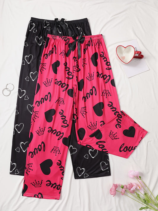 Two cozy plus size sleep pants made from polyester knit fabric with slight stretch. Features an all-season love heart pattern and bow detail.