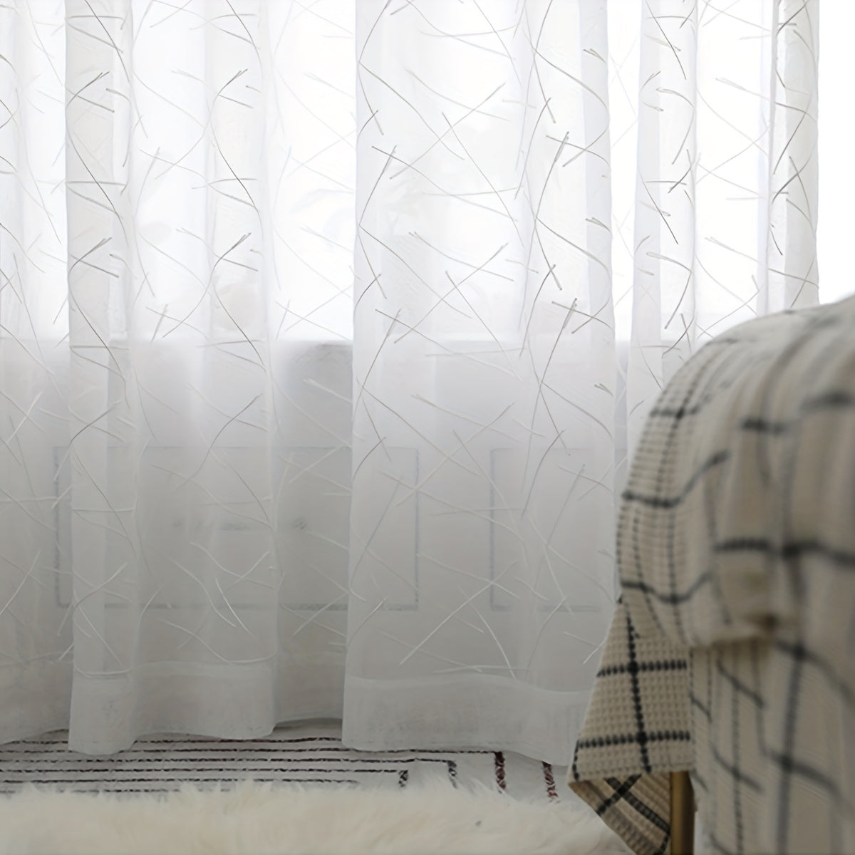 Create a modern and sophisticated look in your living room or bedroom with this 1-piece simple line embroidery sheer curtain. Featuring a sleek geometric design in white, this translucent curtain filters light beautifully while adding a stylish touch to