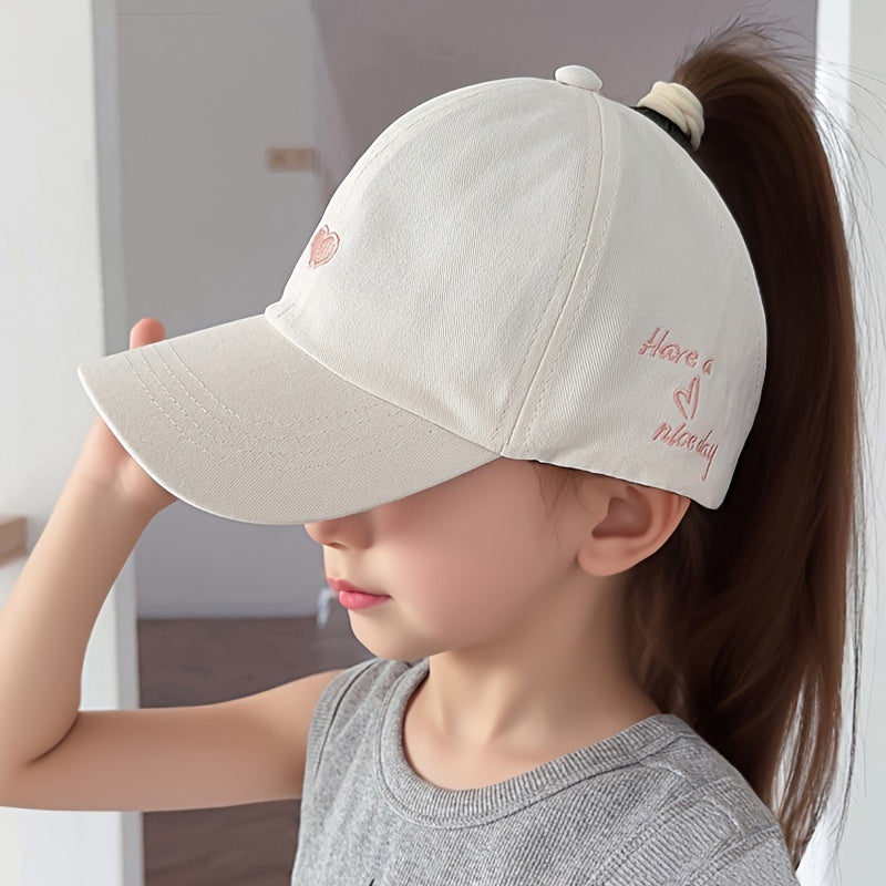 Youngsters' sun protection baseball cap made of 100% polyester with heart pattern, snap closure, and ponytail opening. Suitable for ages 5-10 for daily and casual wear in spring/summer