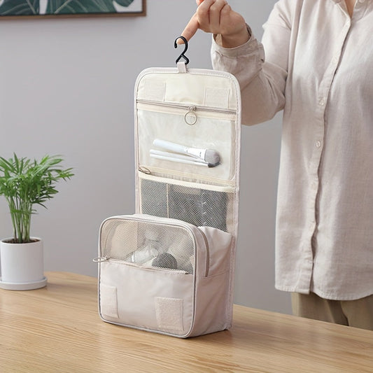 Travel in style with a waterproof Oxford fabric organizer - a versatile folding toiletry bag with a convenient hook for hanging. Available in chic light gray and ivory, this multifunctional bag is perfect for storing cosmetics and other essentials while