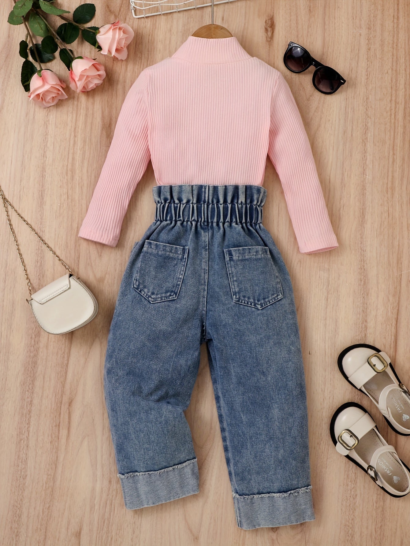 Girl's cotton denim pantsuit includes denim pants and a striped cotton long sleeve top.