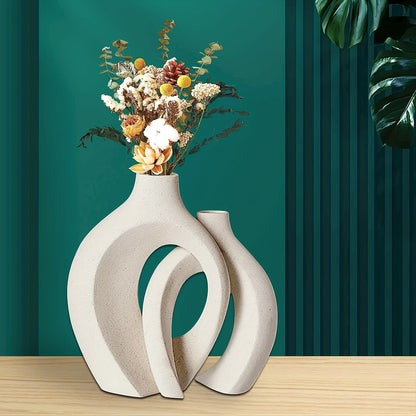 The handcrafted vase features a unique scene of couples cuddling, with two separate vases and a hollow middle that doubles as a work of art, creating a modern atmosphere no matter where it is placed.