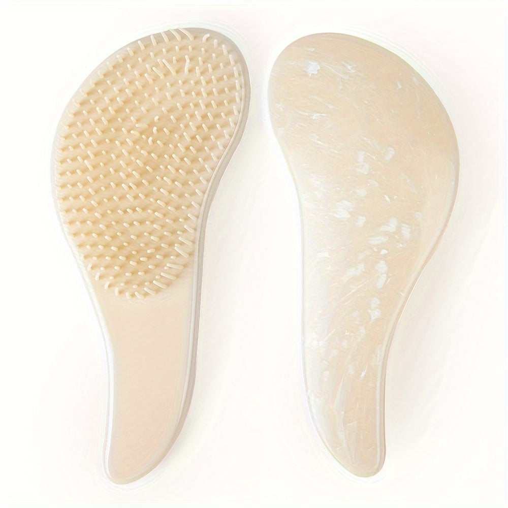 Portable, tiny massage comb for detangling hair with a starry sky design.