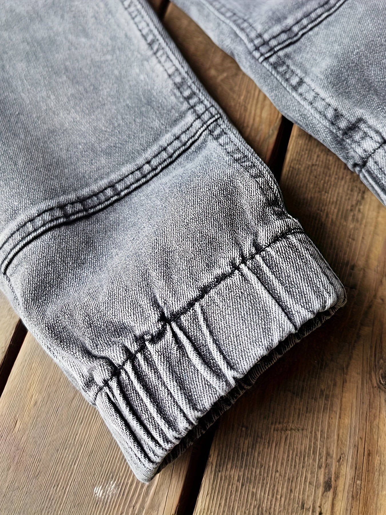 Boys' versatile denim pants with patch detailing for all seasons.