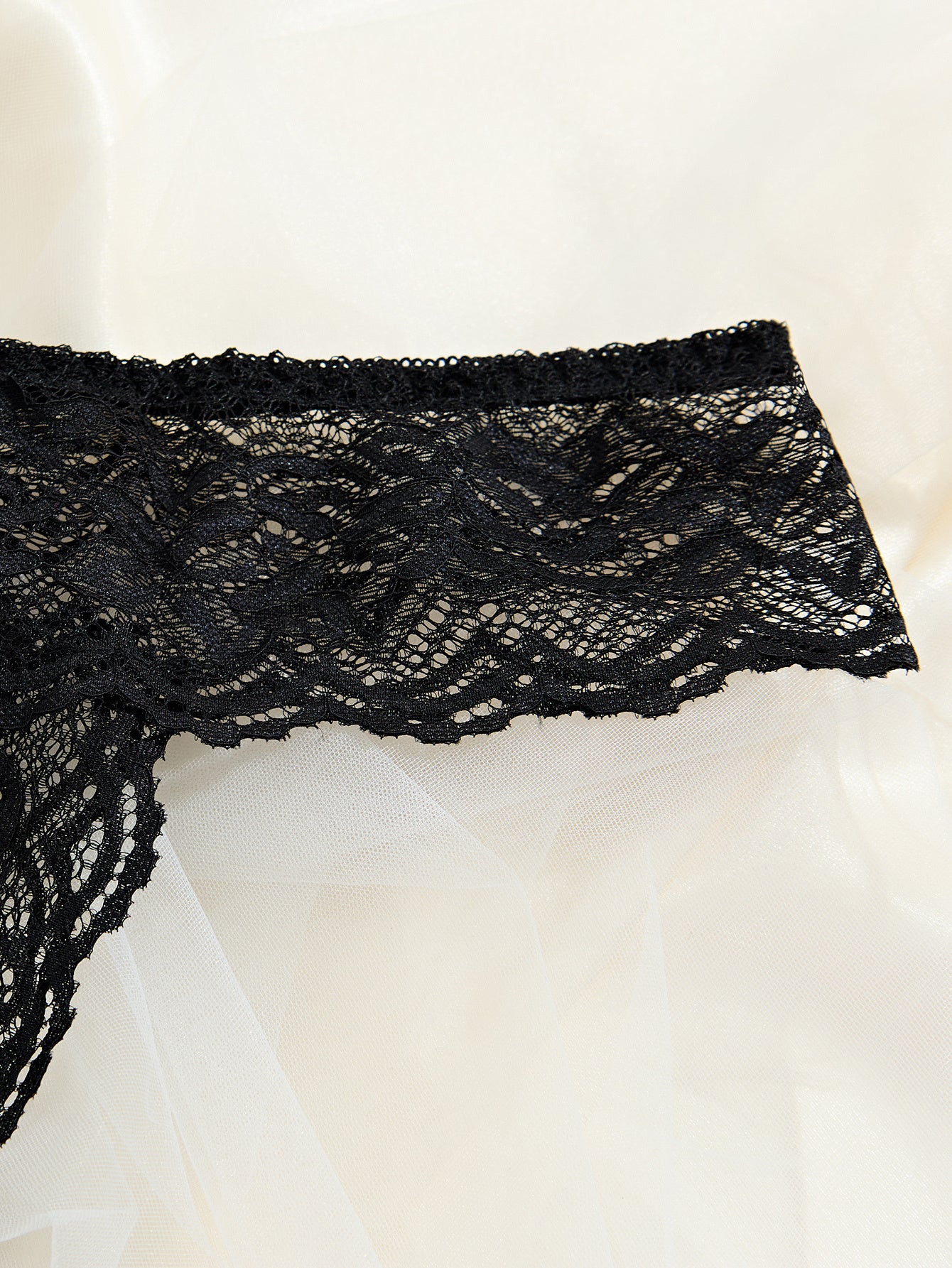 Sexy black lace panties with open crotch, low-rise design, perfect for Valentine’s Day.