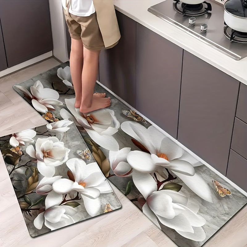 Handcrafted from durable polyester material, this elegant White Magnolia Floral Kitchen Mat features a non-slip design to ensure safety in high traffic areas. With a thickness of 1cm, this machine-made rectangular floor carpet is perfect for bedrooms